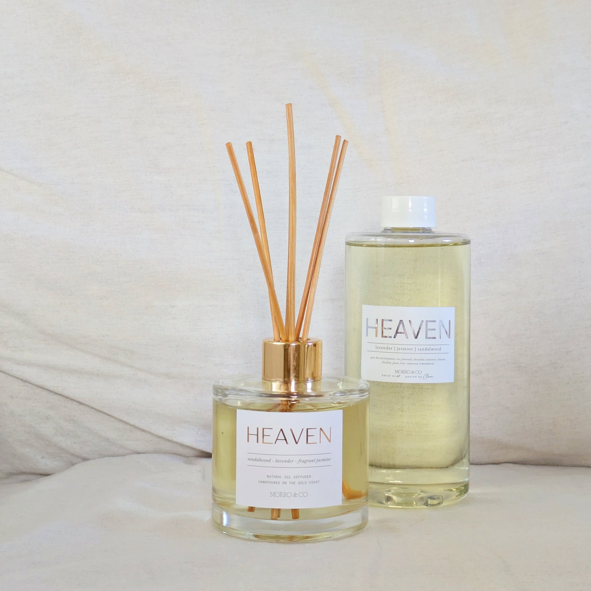 Diffuser bottle and refill bottle of 'Heaven' fragrance on a light background
