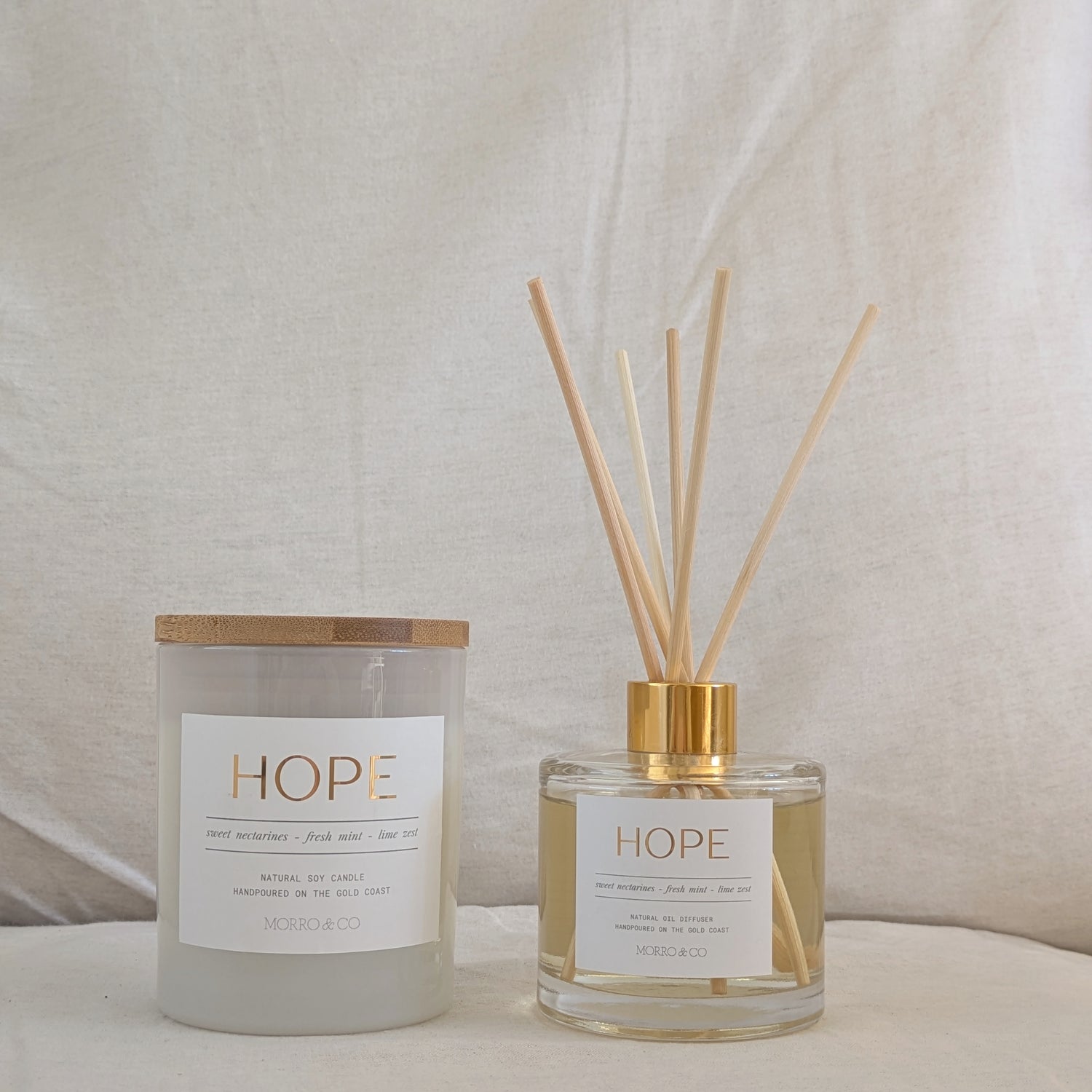 Candle and diffuser set with 'HOPE' label on a neutral background