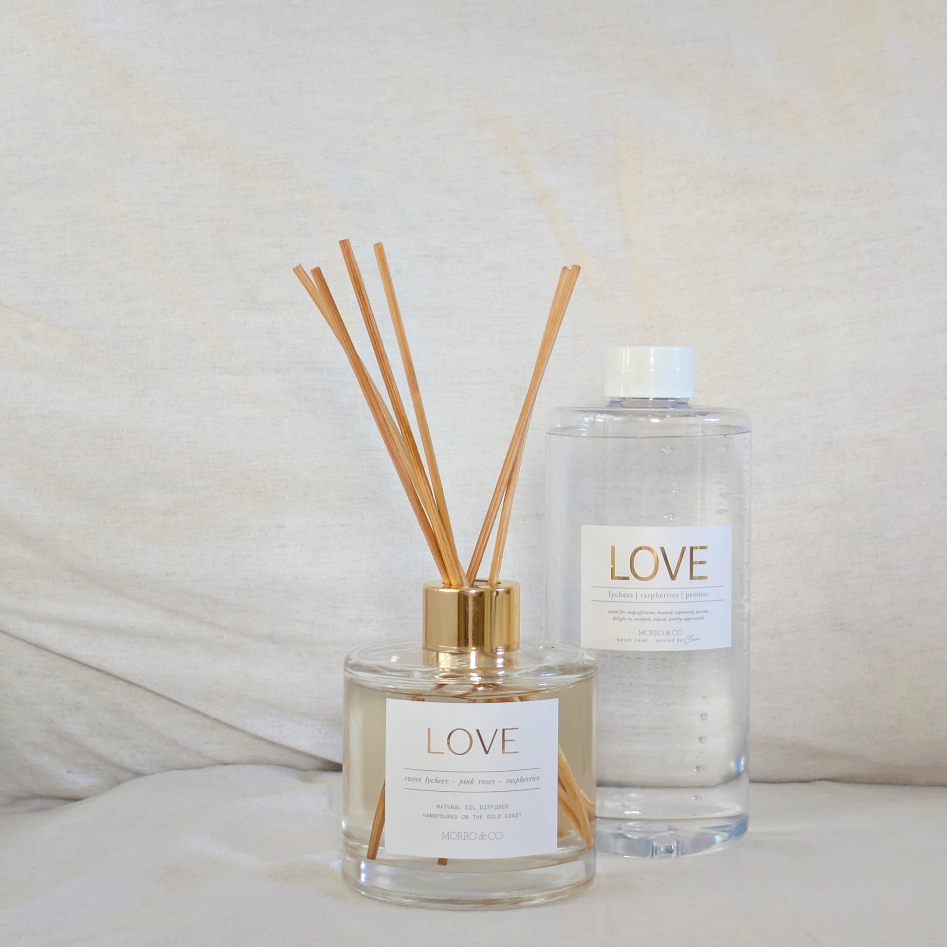 Two diffusers labeled 'LOVE' on a light background