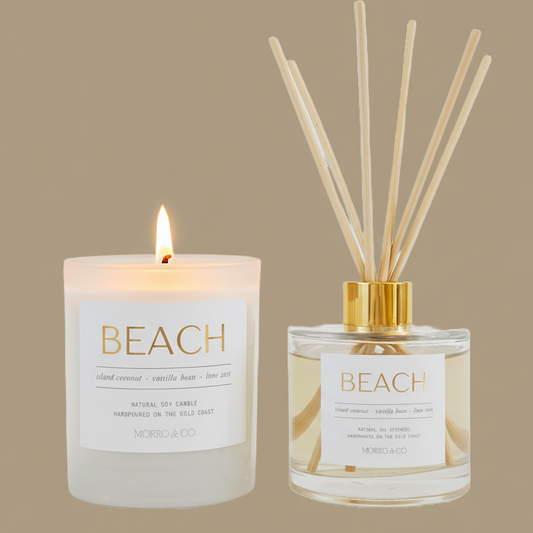 Candle and diffuser set labeled 'Beach' on a beige background