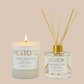 Two 'RESTORE' products, a candle and a diffuser, on a beige background.