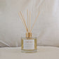 Natural eco reed diffuser with 'Dream' label on a neutral background