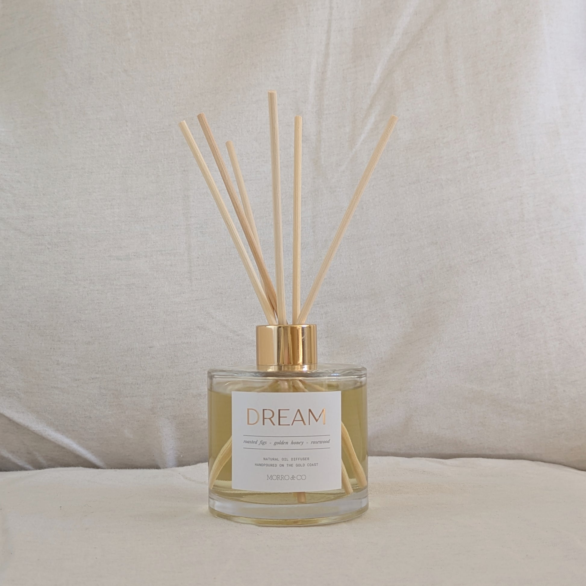 Natural eco reed diffuser with 'Dream' label on a neutral background