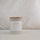 Front of HOPE candle with gold labeled 'HOPE' on a neutral background