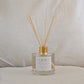 Rejoice eco reed diffuser with wooden sticks on a neutral background