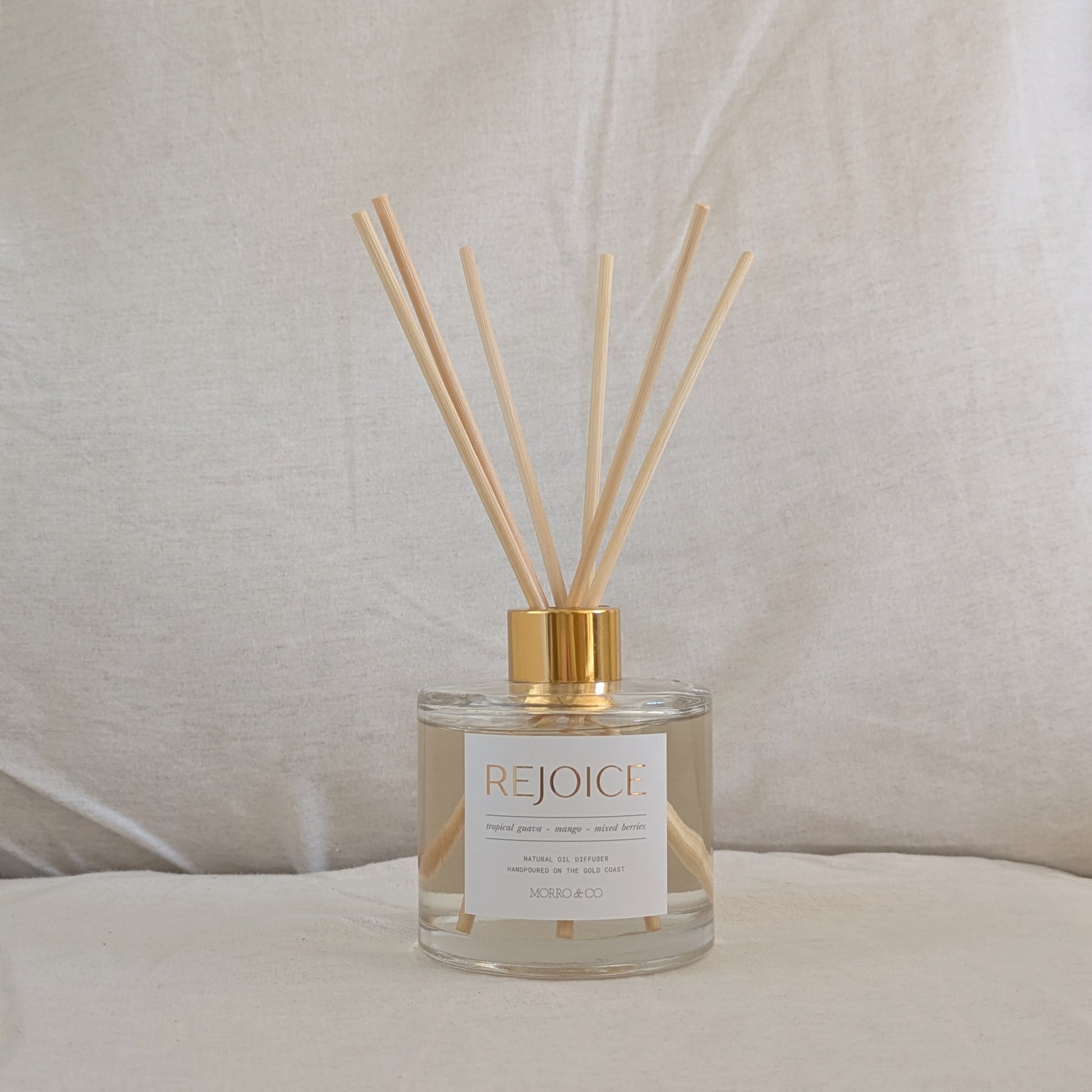 Rejoice eco reed diffuser with wooden sticks on a neutral background
