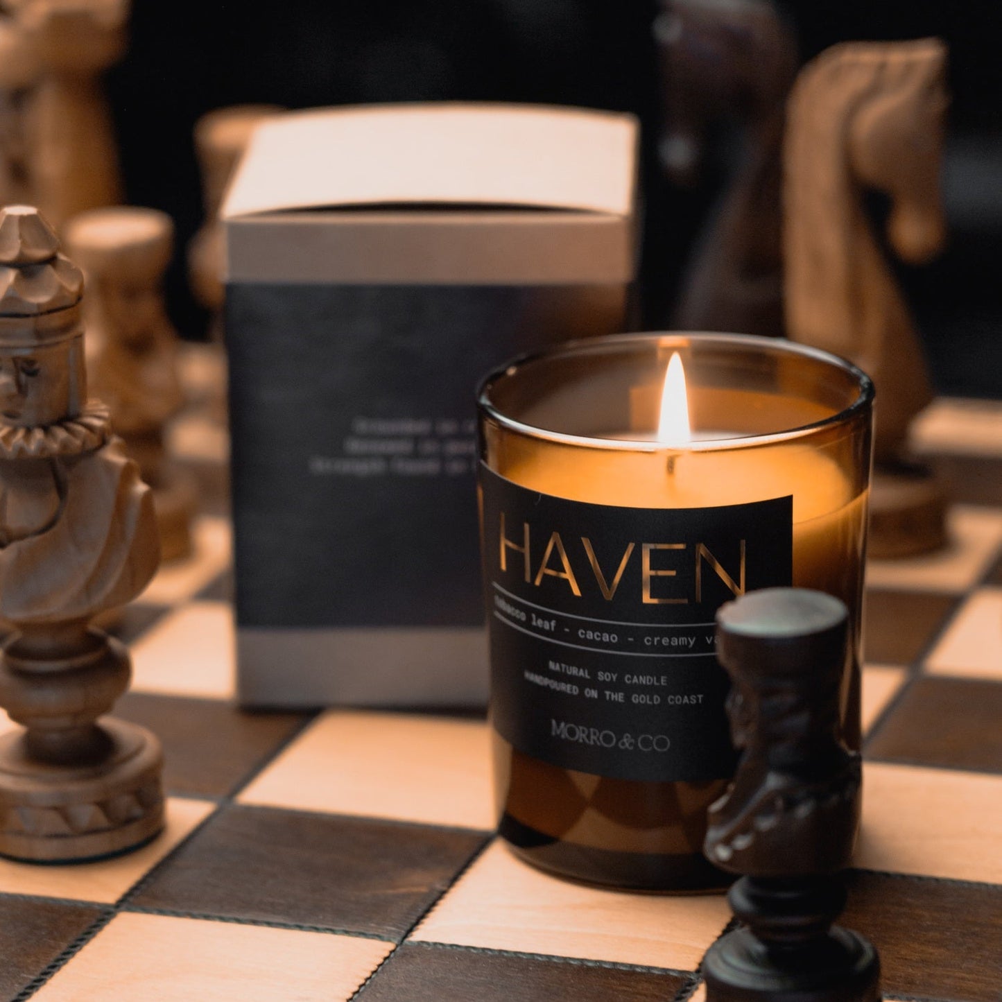 Morro & Co masculine candle labeled 'Haven' on a chessboard with chess pieces.