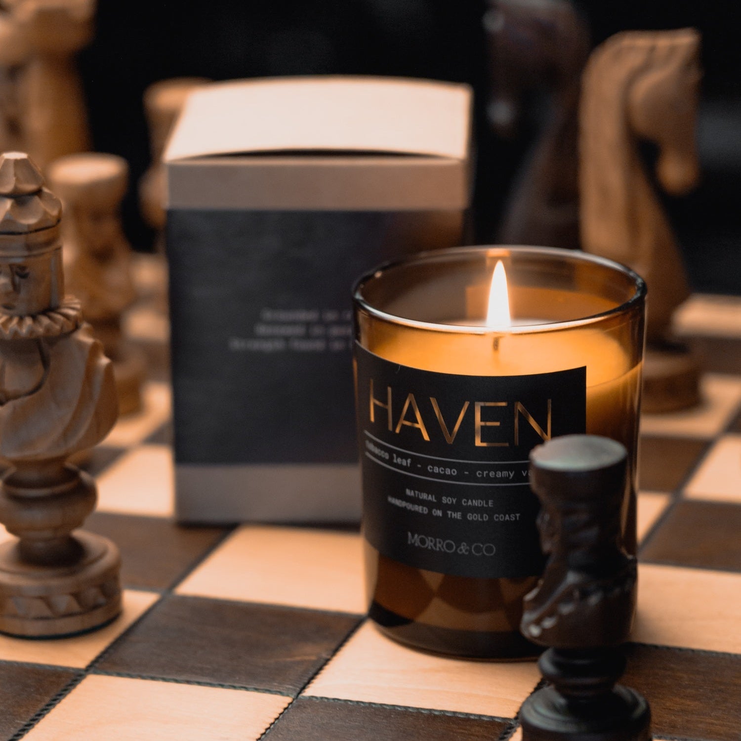 Morro & Co masculine candle labeled 'Haven' on a chessboard with chess pieces.