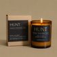 Hunt candle with packaging on a beige background