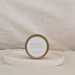 Candle jar labeled 'HOPE' by Morro & Co on a beige background