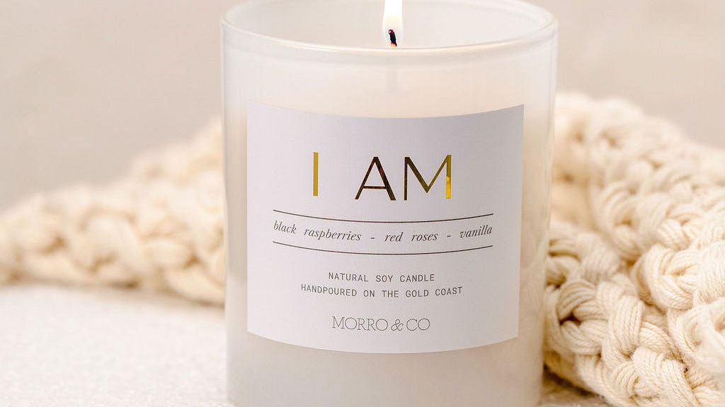 Candle with a label on a textured surface