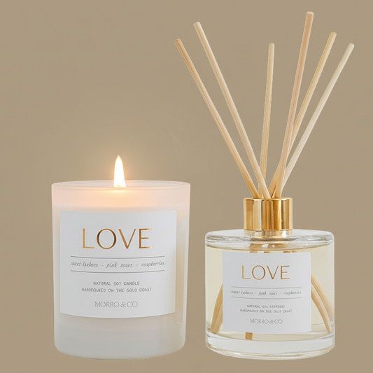 Candle and diffuser set with 'LOVE' label on a beige background