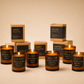 Collection of Morro & Co men's candles and their packaging on a beige background