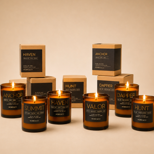 Collection of Morro & Co men's candles and their packaging on a beige background