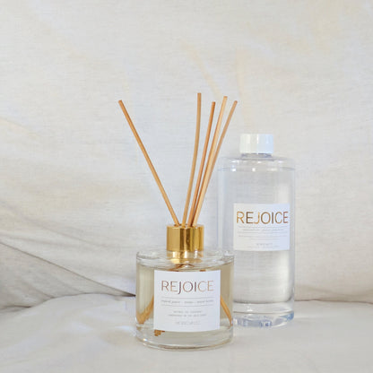 Rejoice eco reed diffuser and bottle on a white surface