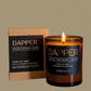 Dapper candle with packaging on a beige background