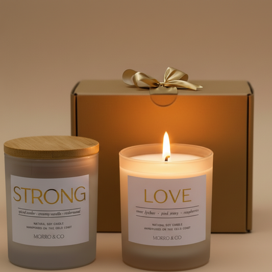 Two candles labeled 'Strong', 'Love', and with a gift box in the background.