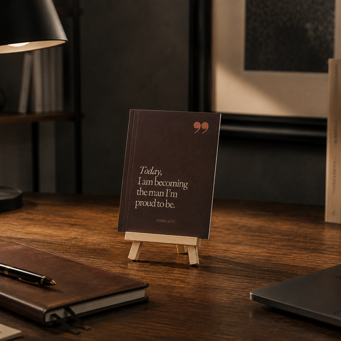 Morro & Co men's affirmation cards displayed on a wooden easel on a home office desk.